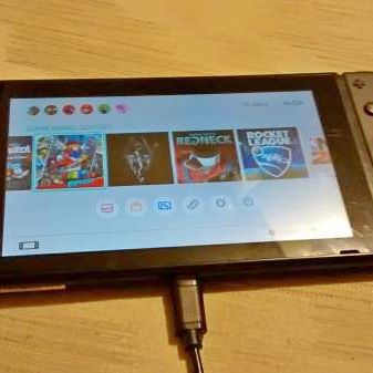 Grey Nintendo Switch with 7 games
